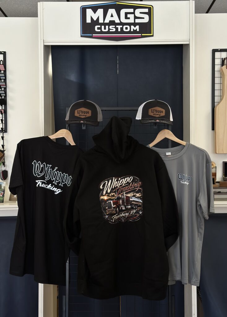 Custom apparel order for Whippo Trucking with DTF shirts, V.I.T. hoodie and Richardson patch hats