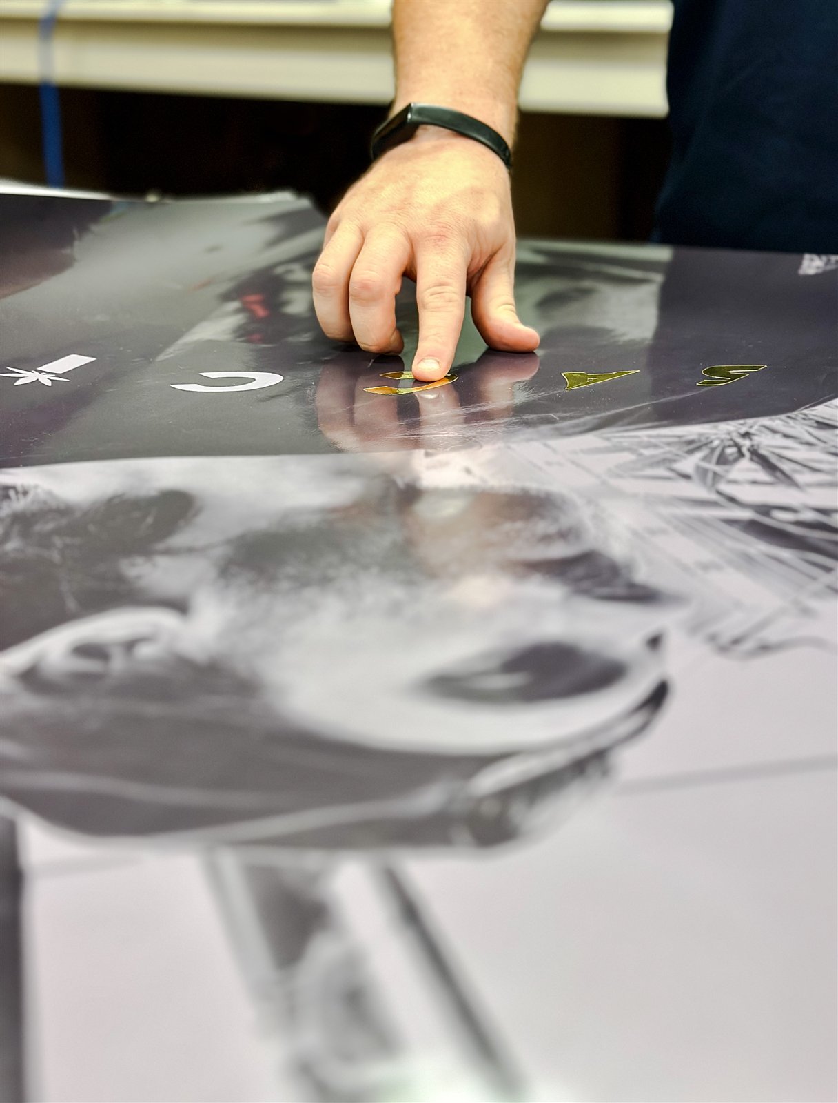 Applying mirrored 3M vinyl letters over the printed counter graphic